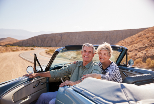 Senior couple in a convertible car